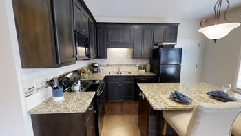 Gourmet kitchen with island & glass top range